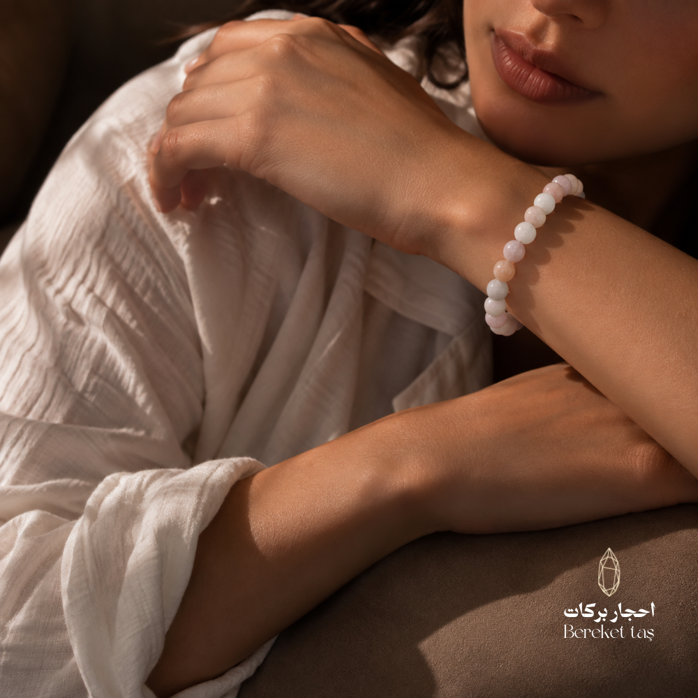 Natural Morganite stone bracelet with soft light pink and white gemstone beads, elegantly worn on the wrist.