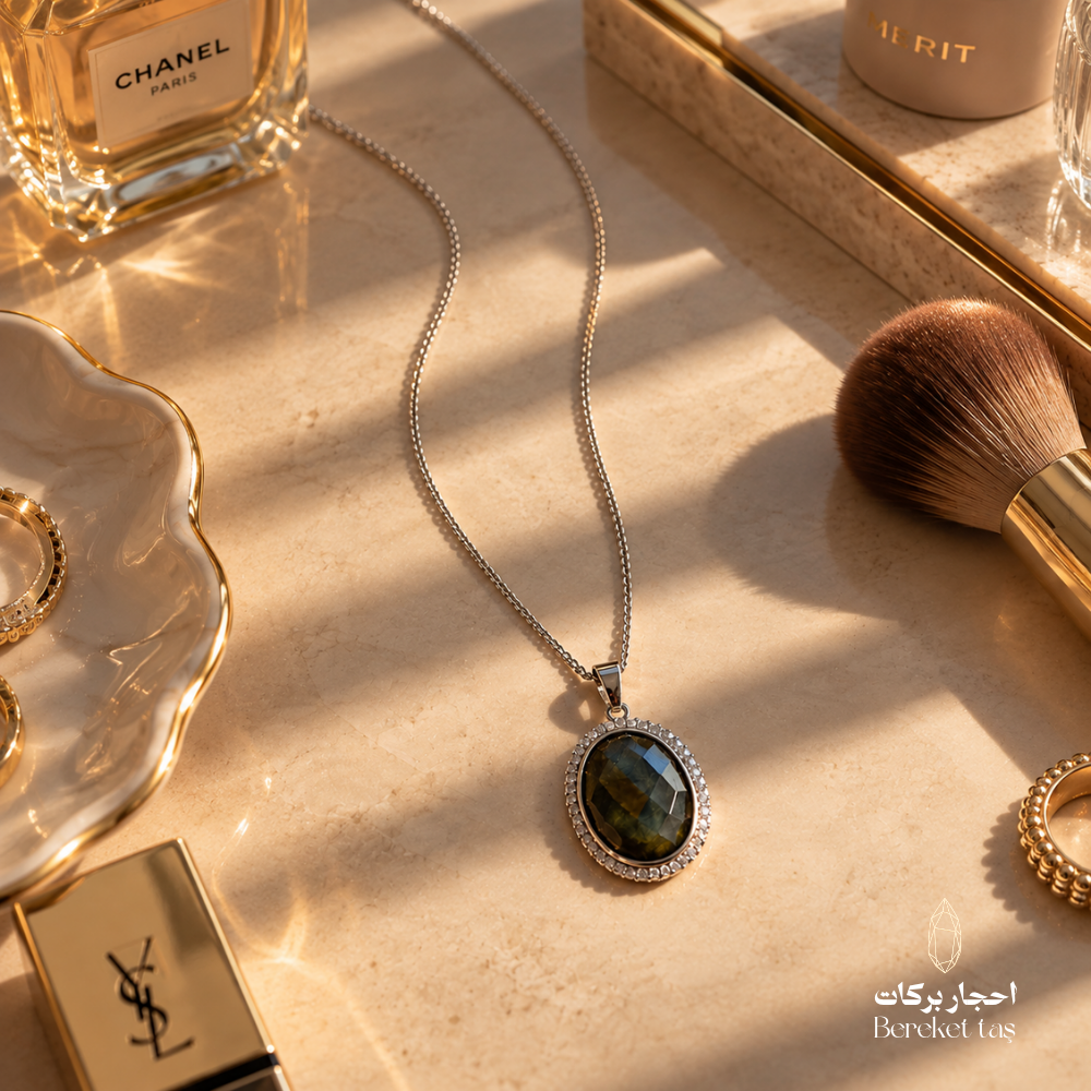 Natural Labradorite Peacock Stone pendant necklace with a silver chain displayed in an elegant luxury flat lay