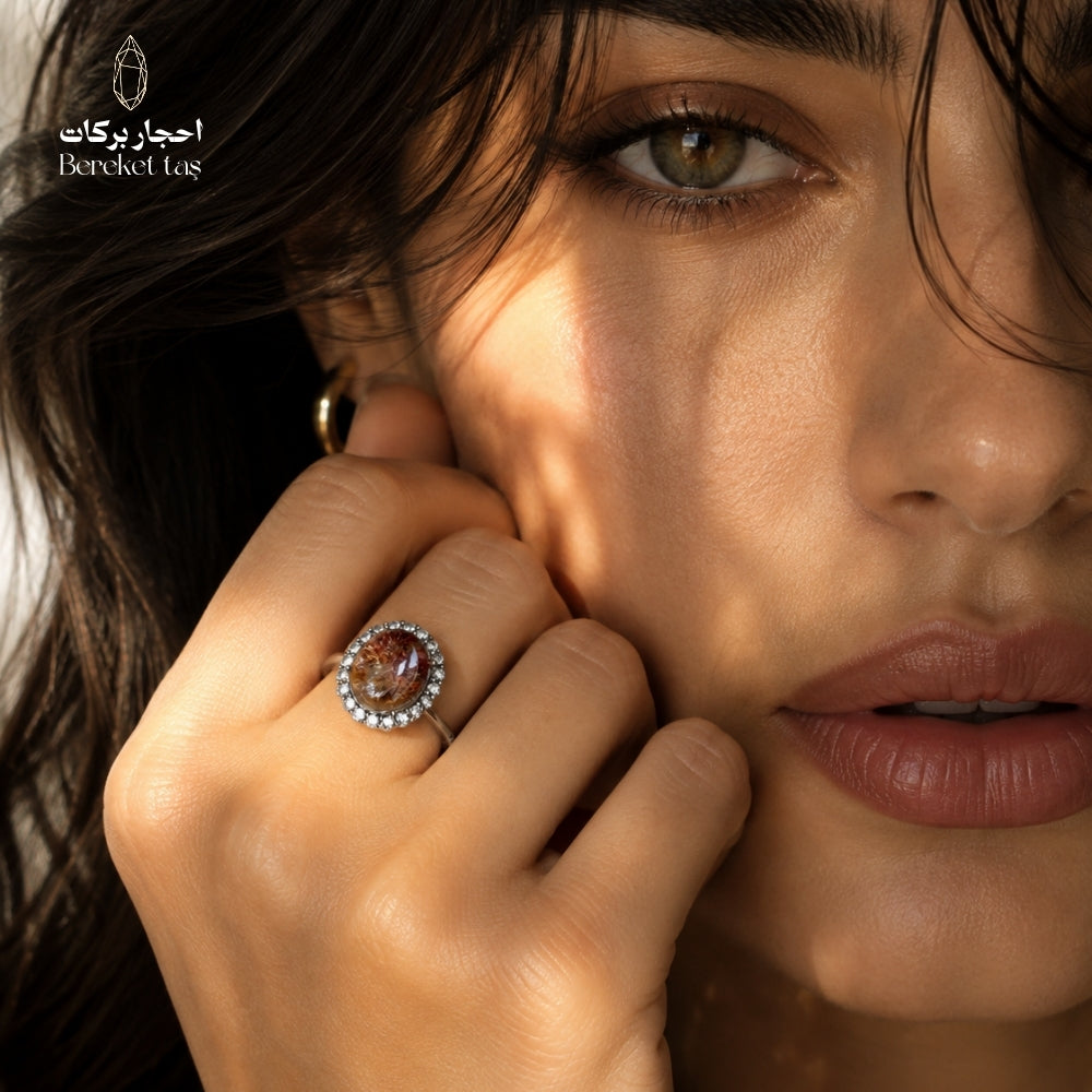Natural Super Seven ring from Madagascar with brown and honey-toned shades, worn on hand