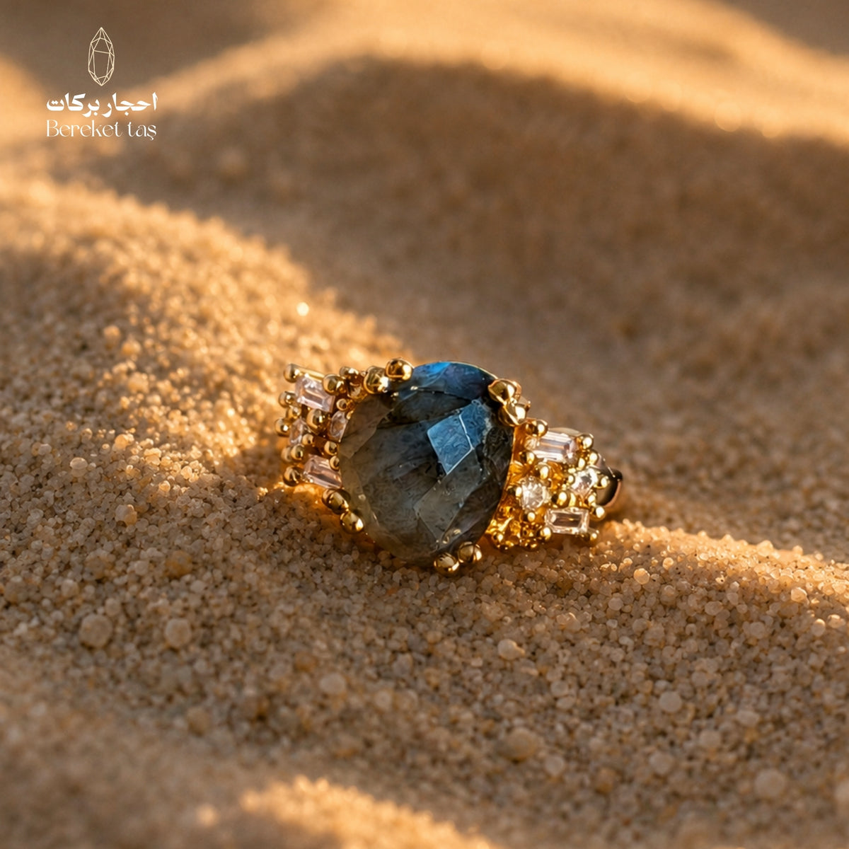 Natural Labradorite ring (Peacock Stone) on sand