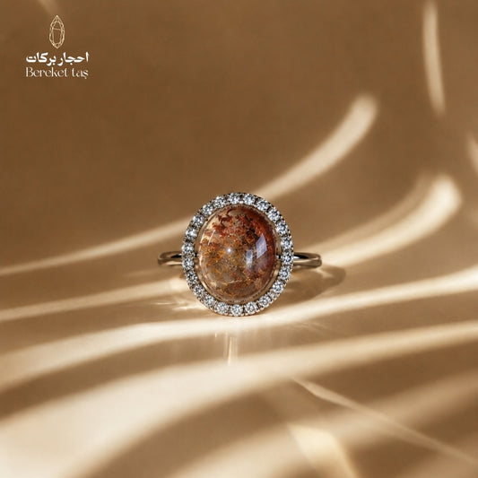 Natural Super Seven ring from Madagascar with brown and honey-toned shades, oval gemstone and elegant halo design