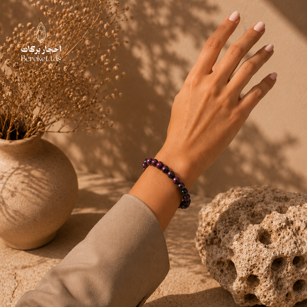 Ruby and Zoisite stone bracelet in deep purple tones worn on the wrist, with a natural and elegant design by Bereket Taş