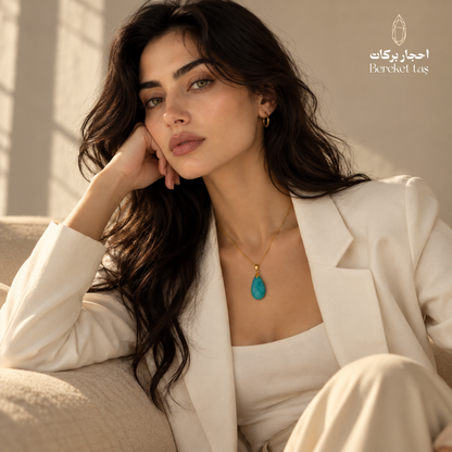 Natural Amazonite pendant necklace with a gold-plated chain styled with an elegant white suit