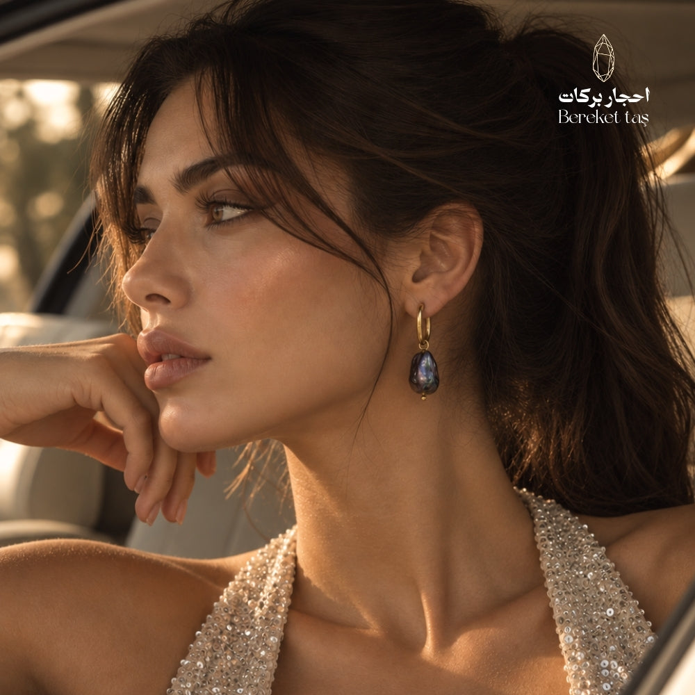 Elegant side profile featuring natural Baroque Pearl earrings with gold-plated copper