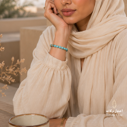 Bereket Taş natural Larimar stone bracelet in light blue, elegantly worn on the wrist with its distinctive natural color and texture.