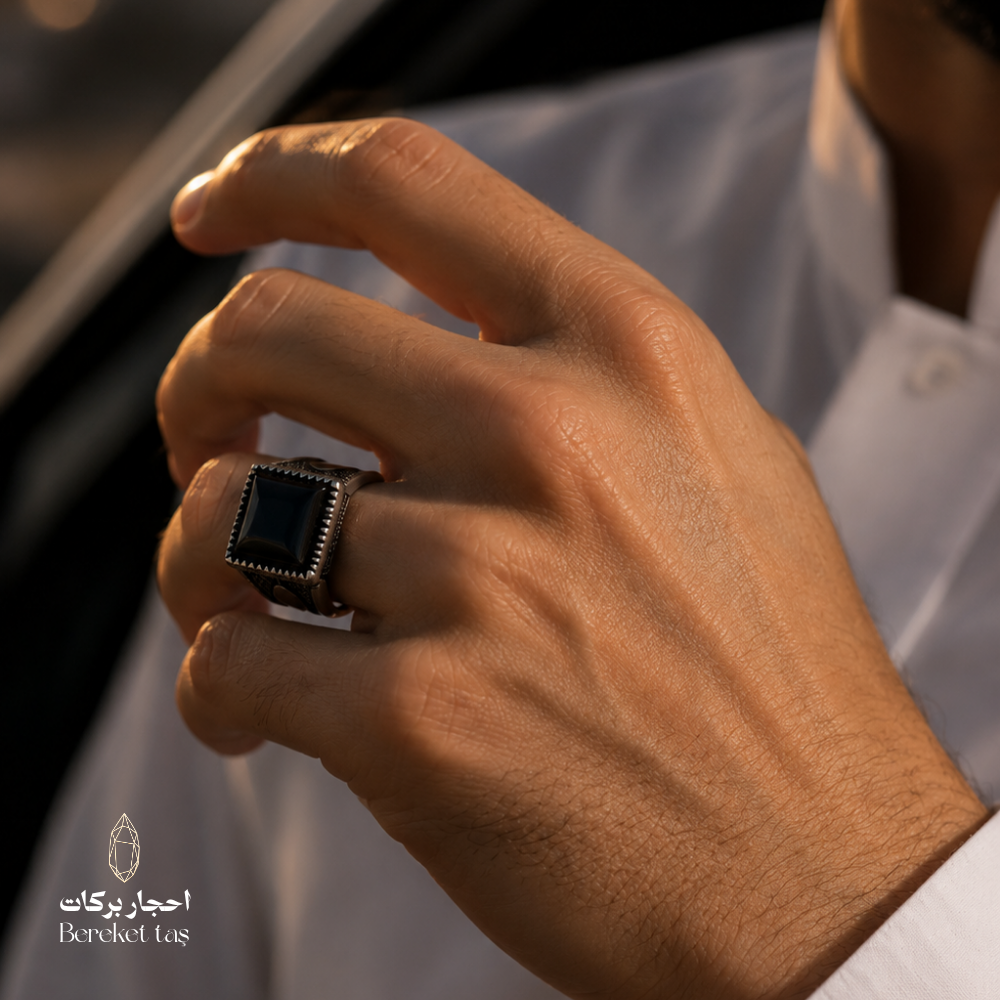 Men's hand wearing a black Onyx ring crafted in 925 Sterling Silver