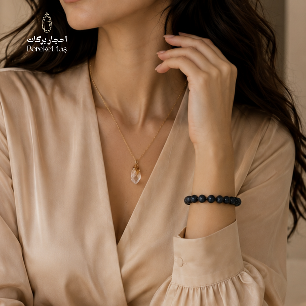 Blue Sapphire bracelet with 6 mm beads worn on the wrist with an elegant outfit