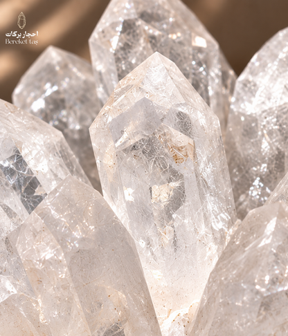 Close-up of natural Brazilian crystal quartz showing clear points and internal inclusions