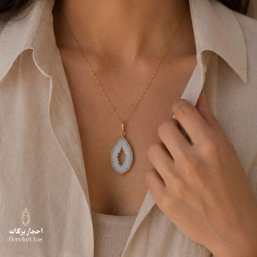 Natural Chalcedony pendant necklace with a gold-plated chain shown in a close-up elegant look
