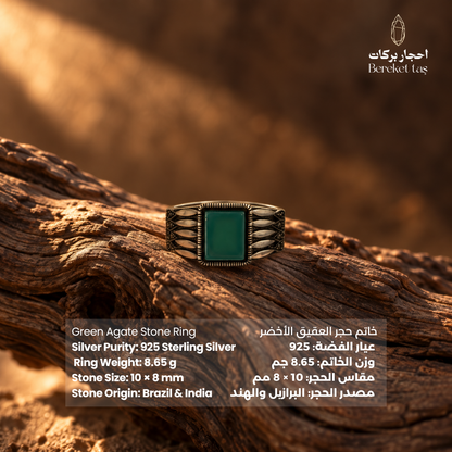 Natural Green Agate men's ring in 925 sterling silver shown from the front on textured wood, highlighting the rectangular gemstone and ornate side details