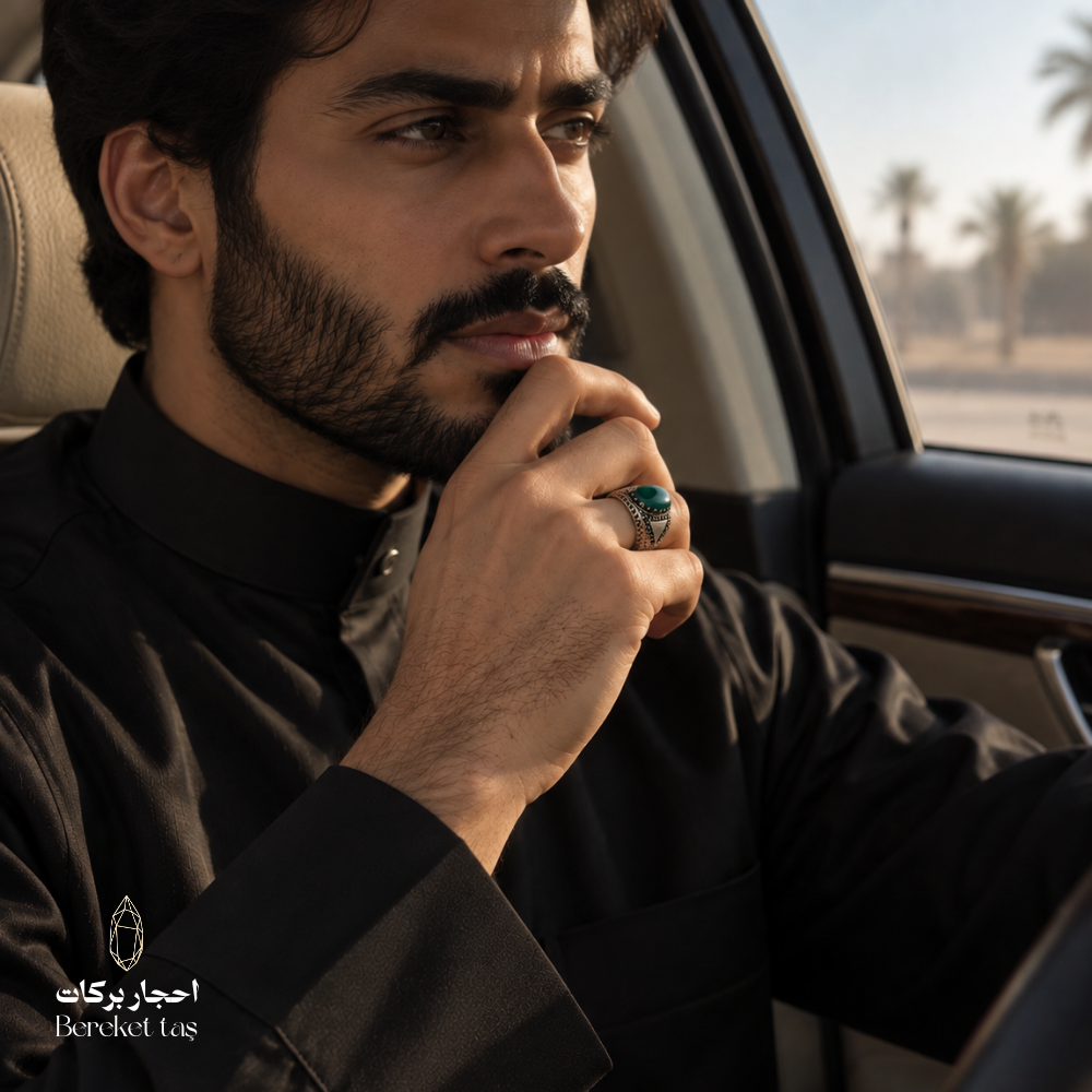 Man wearing a natural Green Agate ring in 925 Sterling Silver, showcasing the polished gemstone and ornate setting in a refined men's look