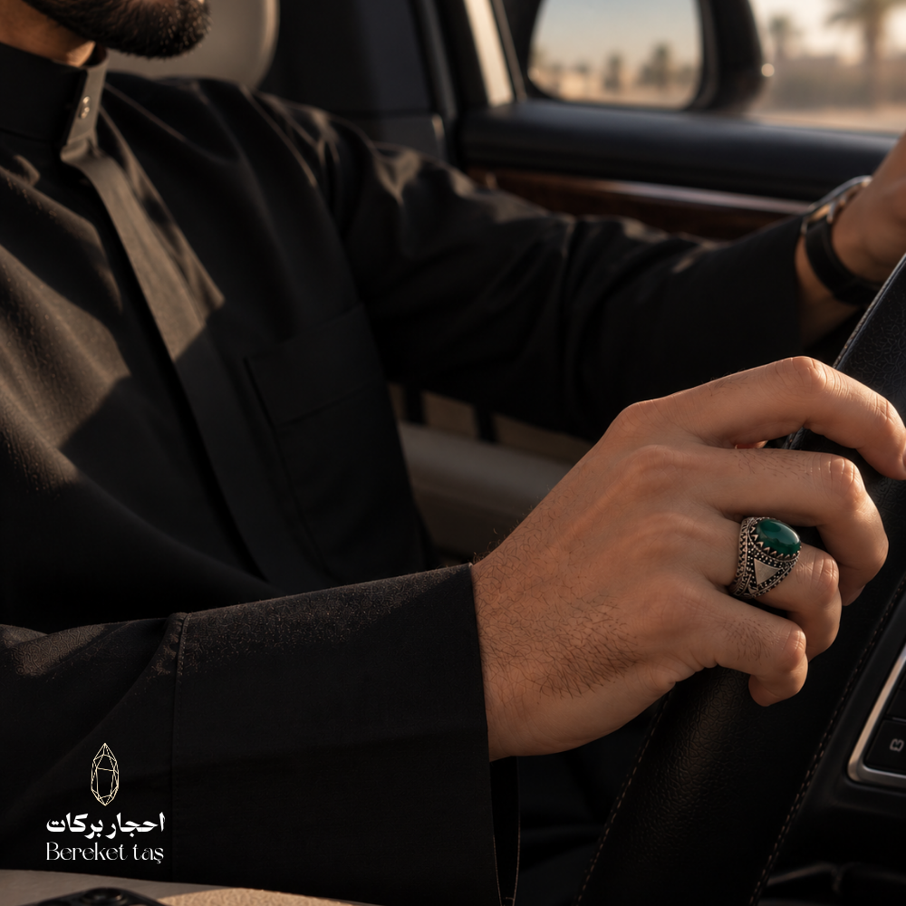 Man wearing a natural Green Agate ring in 925 Sterling Silver while driving, highlighting the gemstone and detailed silver setting