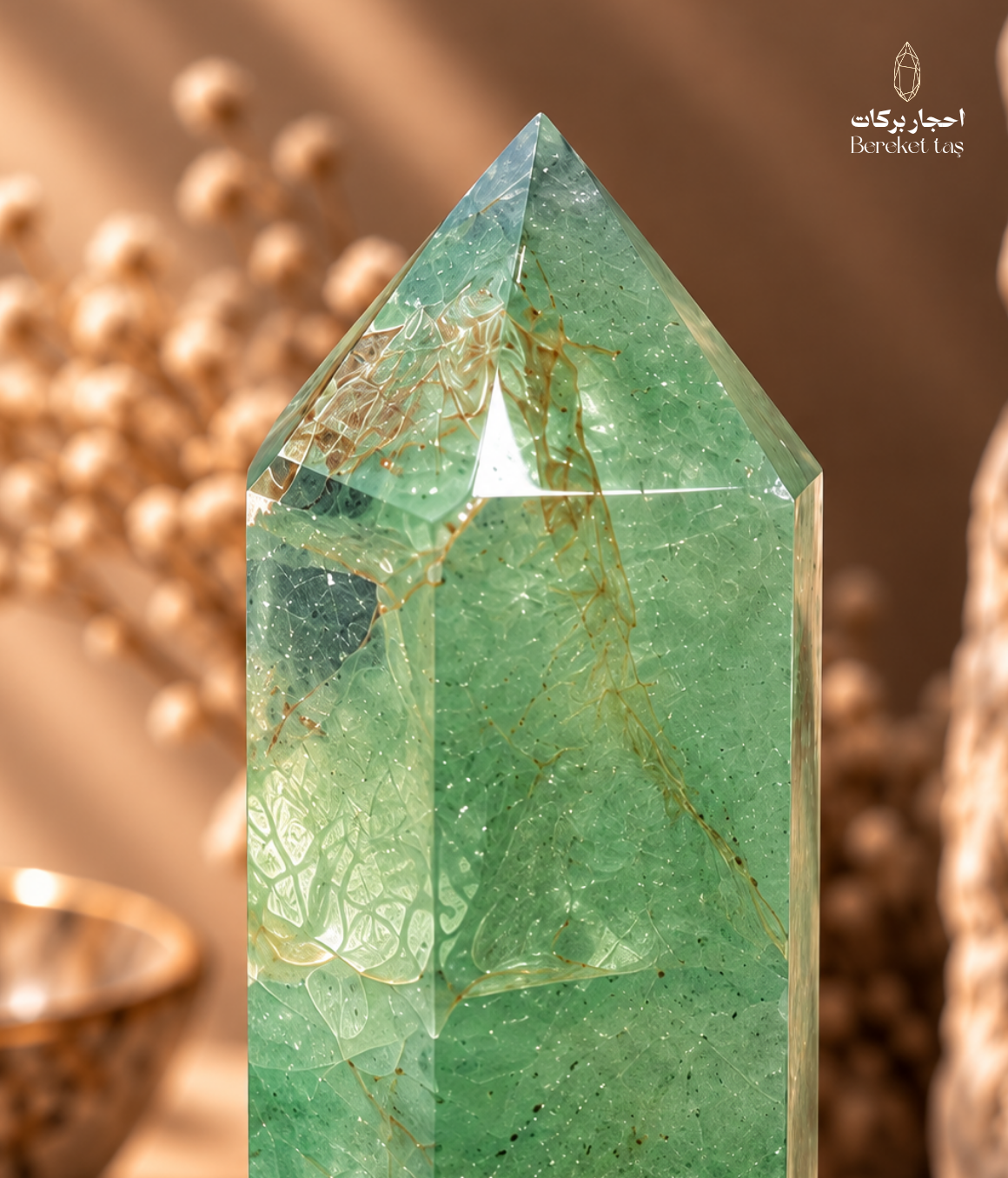 Close-up of a green fluorite crystal point showing natural inclusions and internal patterns