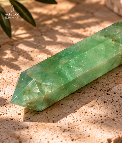 Green fluorite crystal point shown from a side angle with natural internal patterns