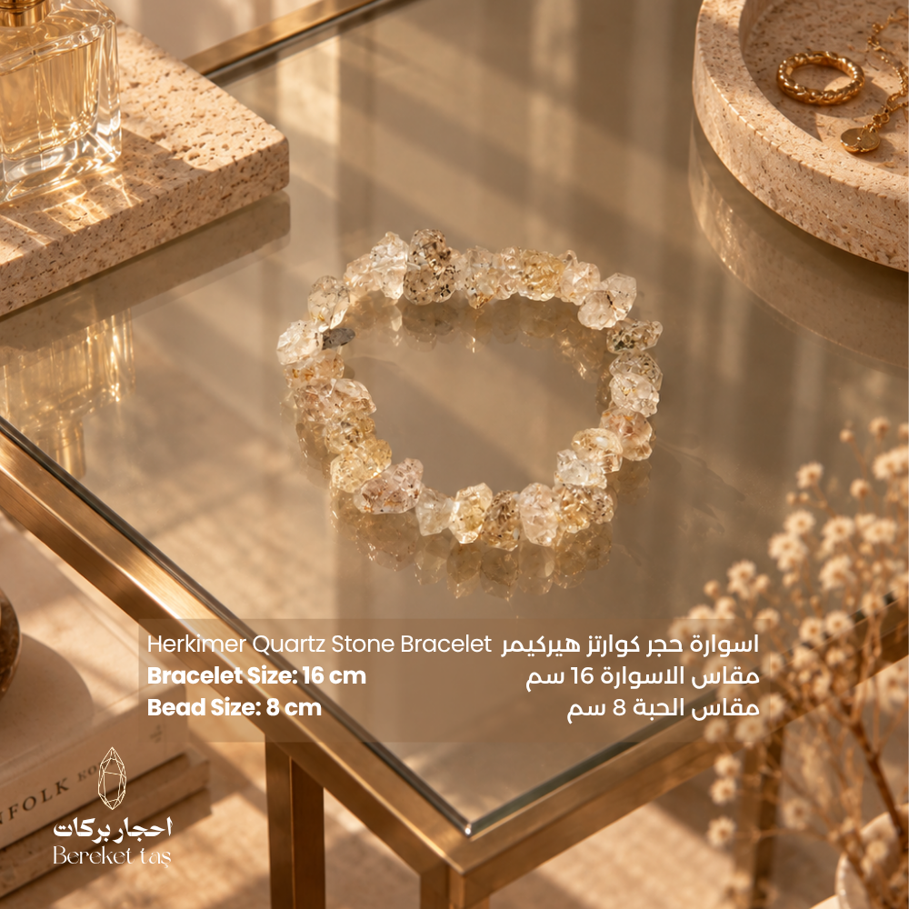 Herkimer Quartz stone bracelet with natural crystal beads displayed on an elegant glass surface