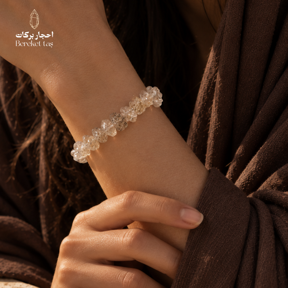 Natural Herkimer Quartz bracelet with translucent crystal beads worn on the wrist