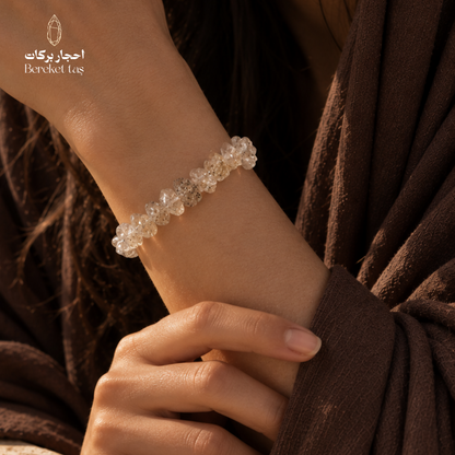 Natural Herkimer Quartz bracelet with translucent crystal beads worn on the wrist