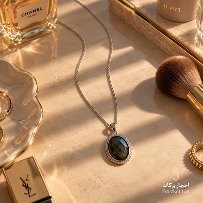Natural Labradorite Peacock Stone pendant necklace with a silver chain displayed in an elegant luxury flat lay