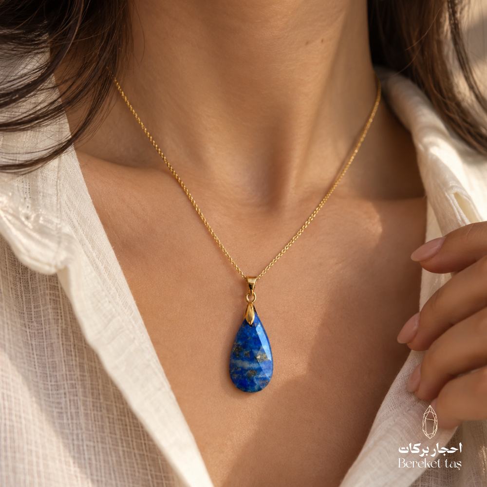 Close-up of a blue Lapis Lazuli pendant necklace with a gold-plated chain