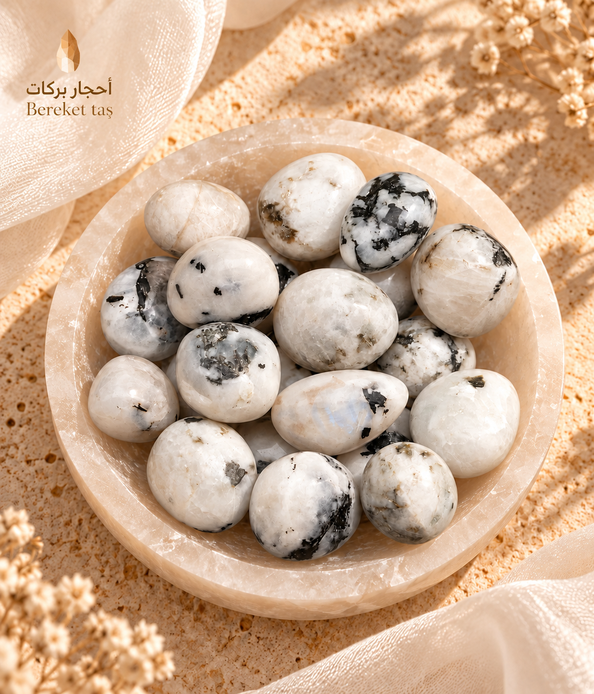 Natural polished Madagascar Moonstone stones arranged in a decorative bowl with varied natural patterns