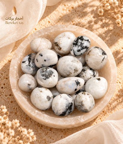 Natural polished Madagascar Moonstone stones arranged in a decorative bowl with varied natural patterns