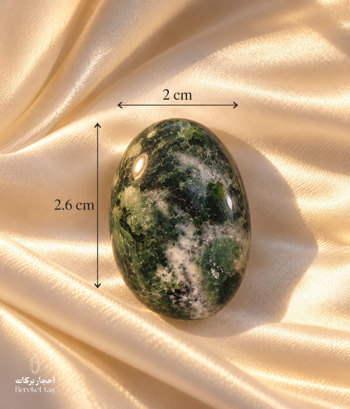Natural polished Moss Agate stone showing its 2.6 cm length and 2 cm width, with green and white natural patterns