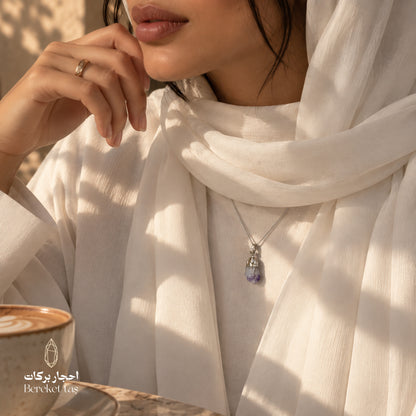 Natural Amethyst silver pendant necklace styled with an elegant white outfit