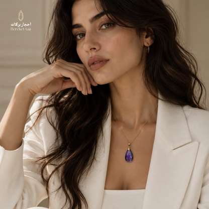 Natural Amethyst pendant necklace with a gold-plated chain styled with an elegant white outfit