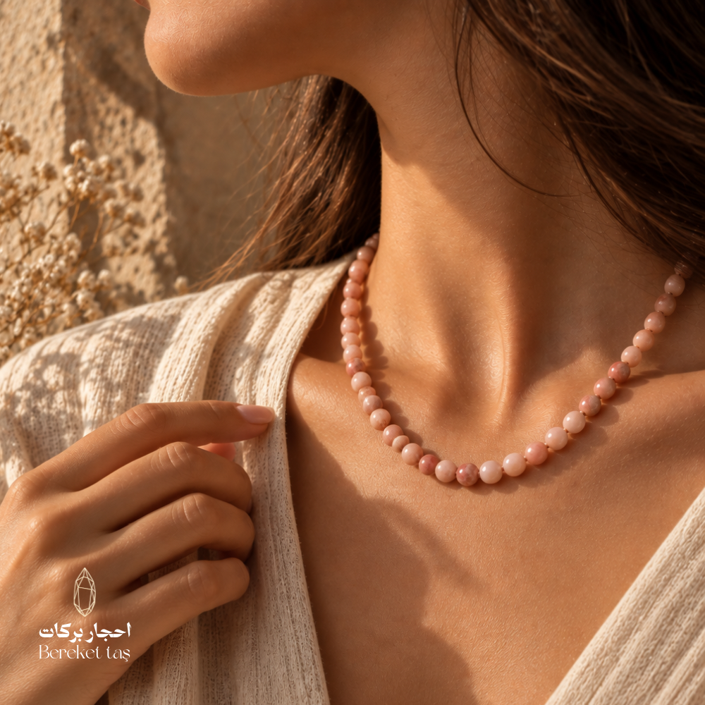 Natural Bambi Opal beaded necklace in soft pink and peach tones styled with an elegant neutral outfit