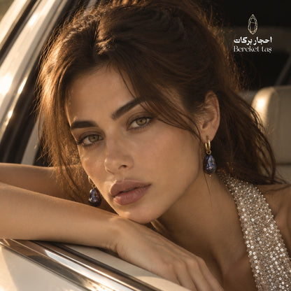 Natural Baroque Pearl earrings with gold-plated copper styled in an elegant portrait