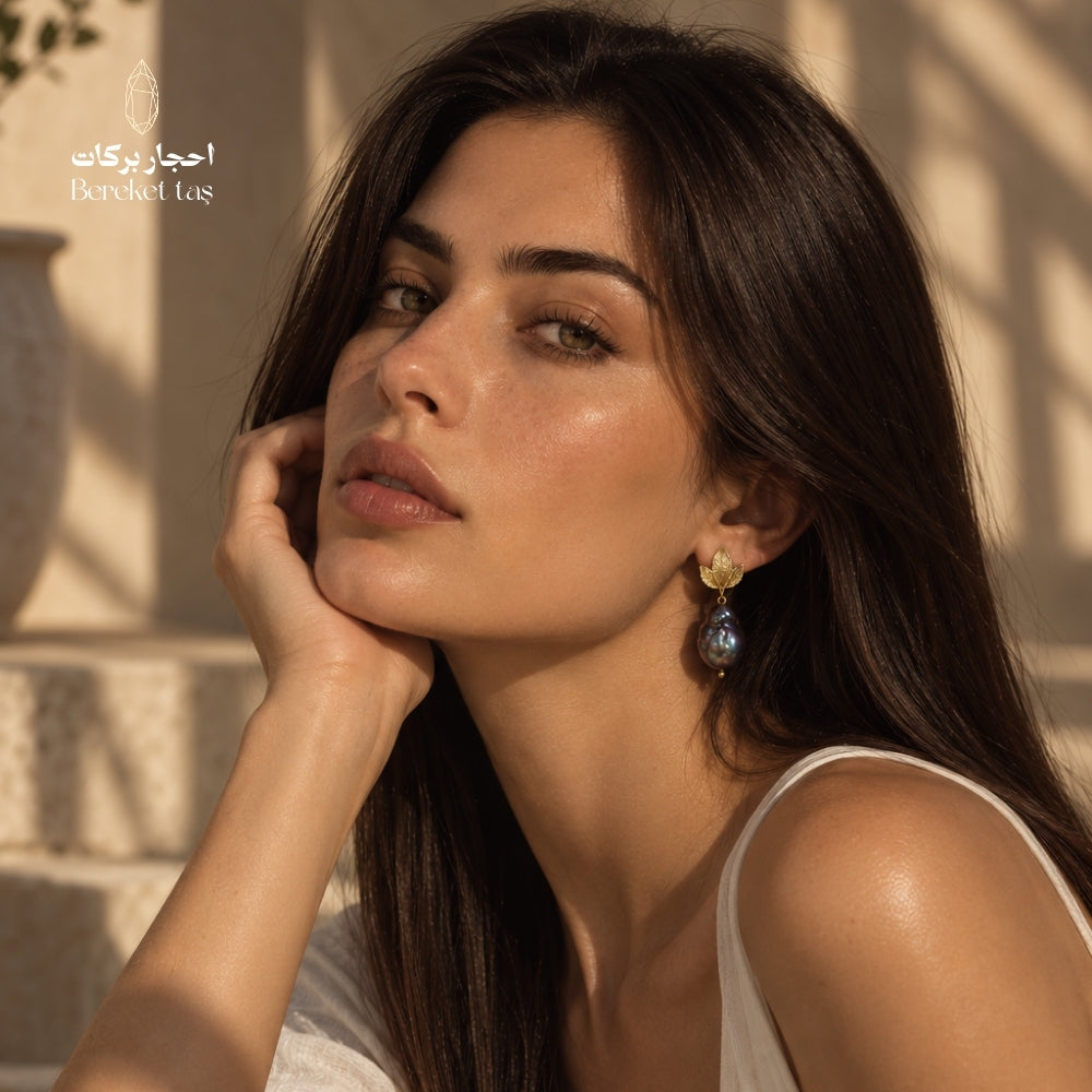 Elegant portrait featuring natural Baroque Pearl earrings with gold-plated copper leaf details