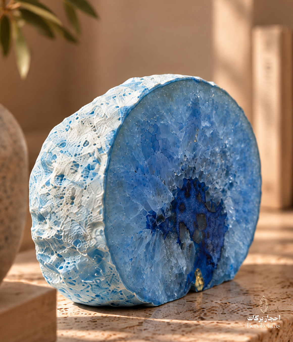 Natural Brazilian blue agate geode shown from a side angle with crystalline interior
