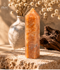 Natural Brazilian orange calcite tower with translucent crystal formations