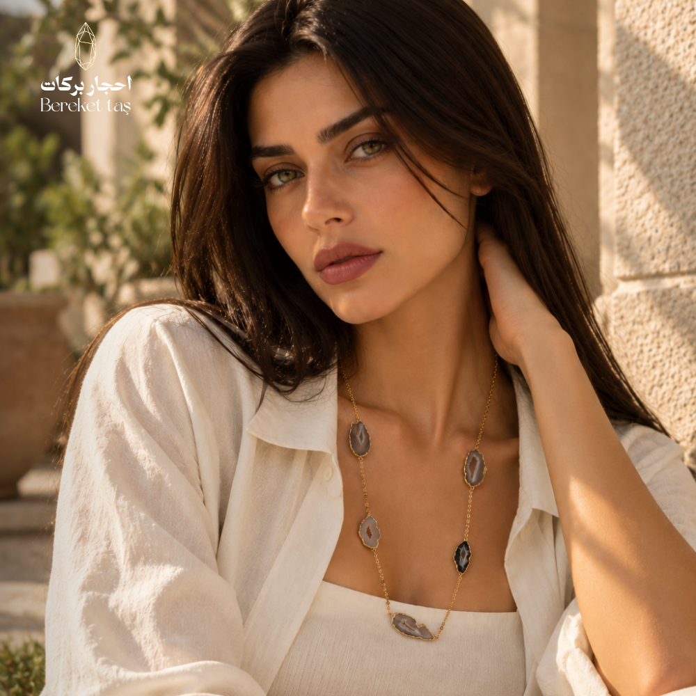 Natural Chalcedony necklace from Brazil styled with an elegant white outfit, showcasing the distinctive stone arrangement