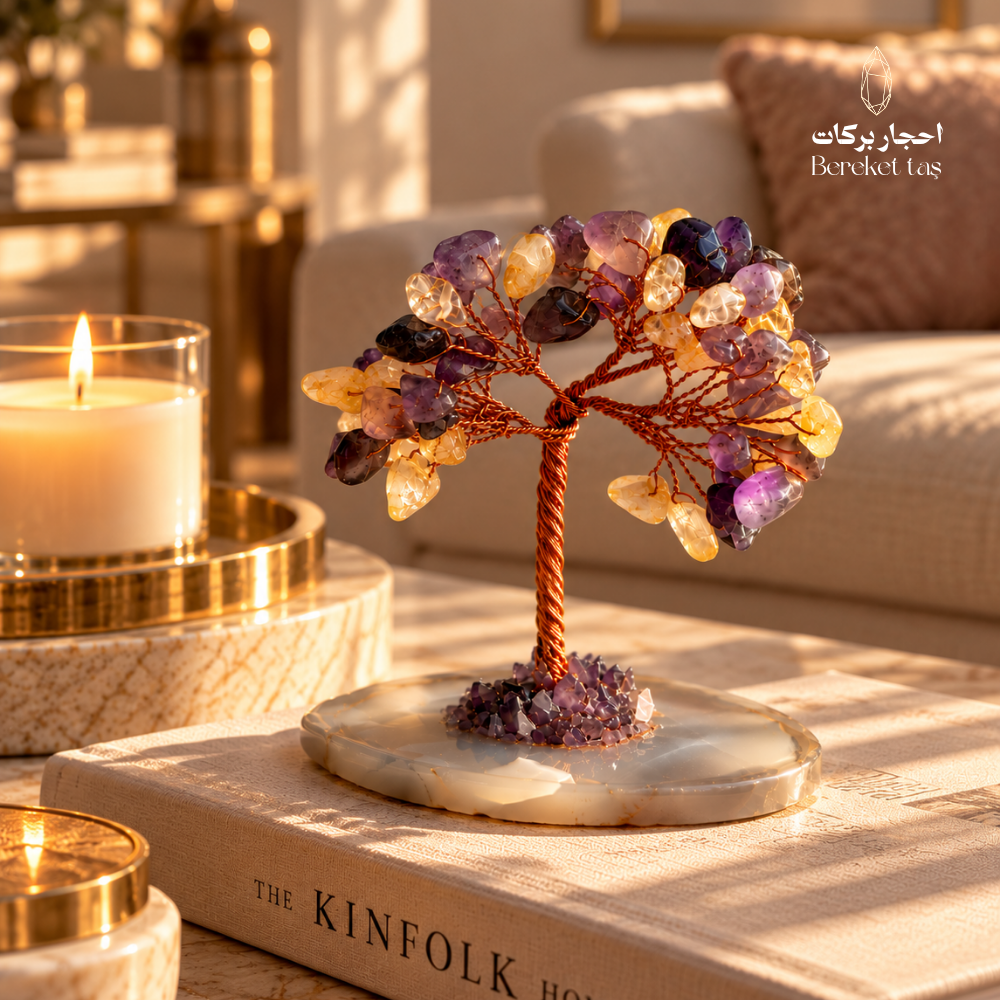 Natural Citrine and Amethyst gemstone tree with an Agate stone base displayed on a coffee table