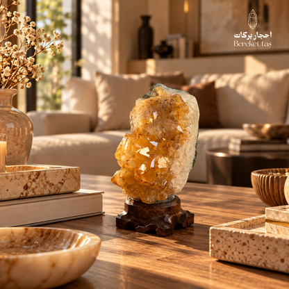 Natural Citrine crystal specimen displayed on a wooden table in an elegant living room