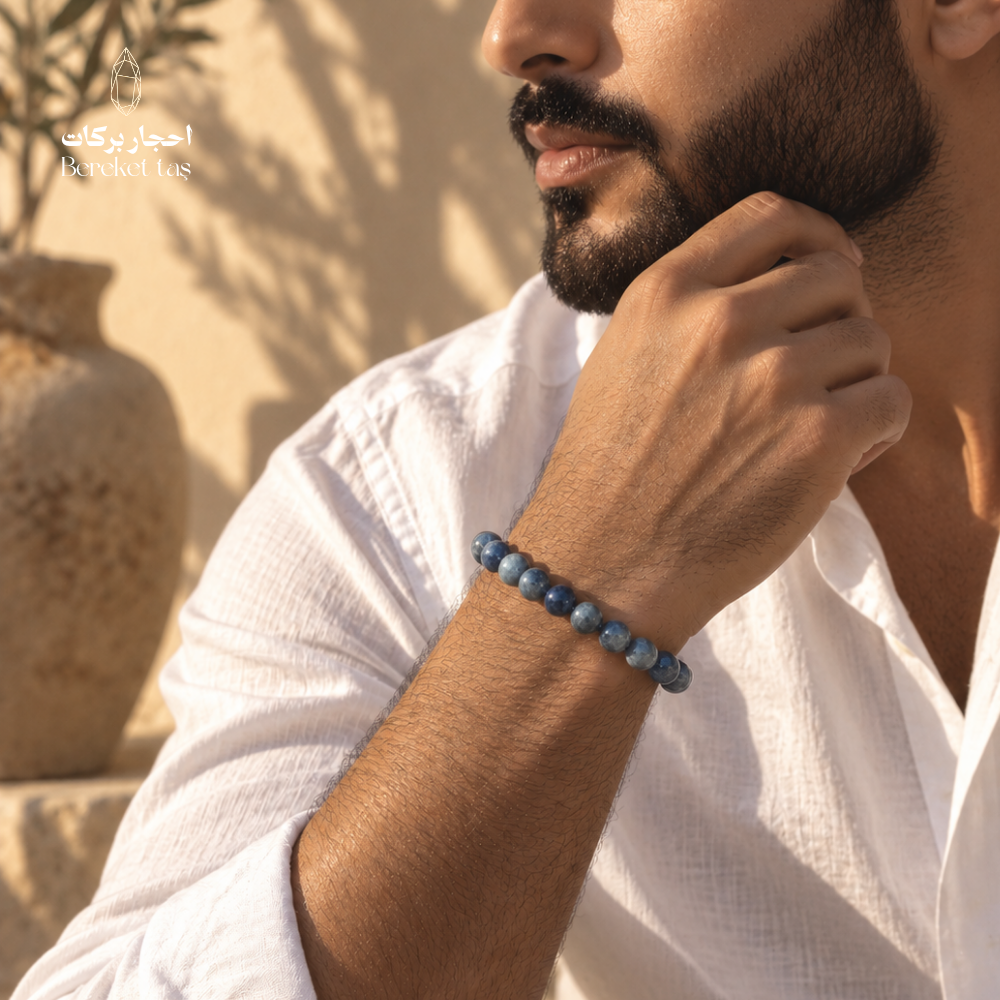 Natural Kyanite bracelet with deep blue gemstone beads styled on a man's wrist
