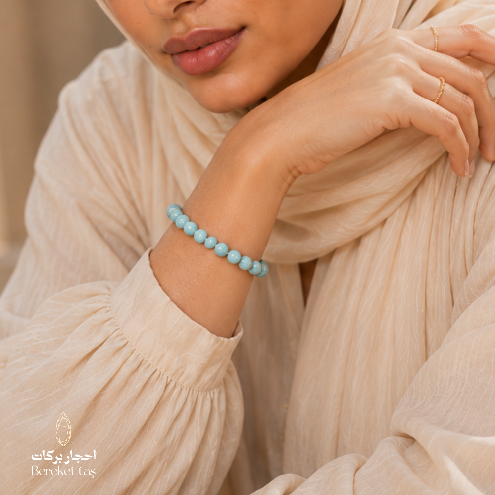 Natural light blue Larimar stone bracelet by Bereket Taş, styled on the wrist to highlight the stone’s soft color and natural texture.