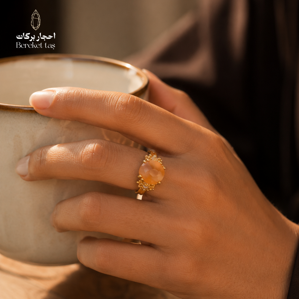 Natural Madagascar Agate ring worn on hand holding a cup