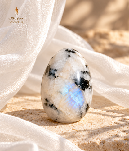 Natural polished Madagascar Moonstone individual stone with white tones and distinctive dark natural inclusions
