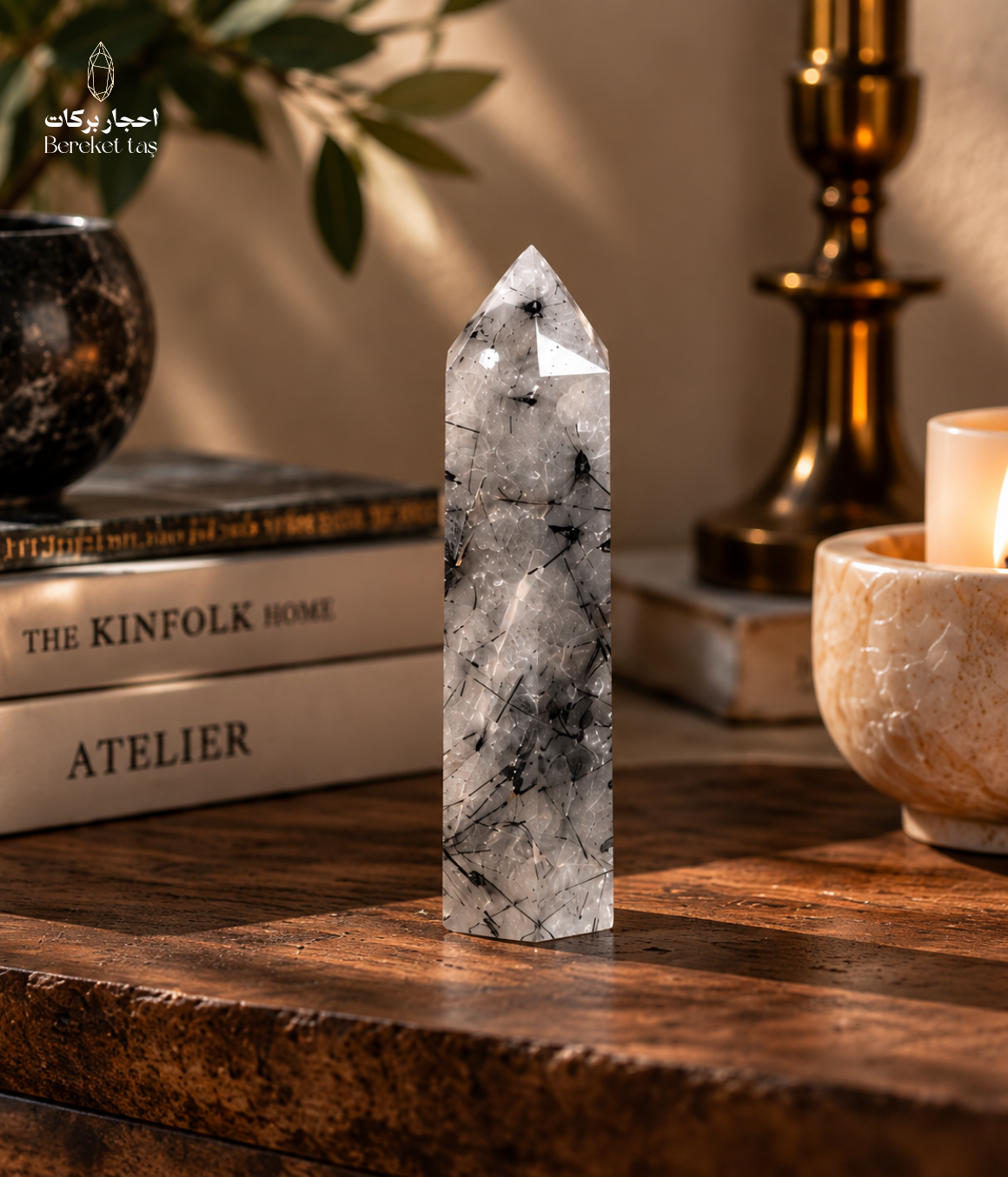 Natural Madagascar tourmalinated quartz displayed on a wooden table in a warm interior setting