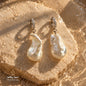 Close-up of handcrafted natural Pearl earrings with 925 sterling silver hoops