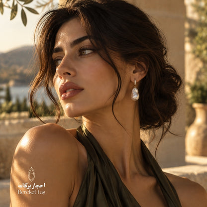 Natural Pearl drop earring with 925 sterling silver worn in a refined outdoor setting