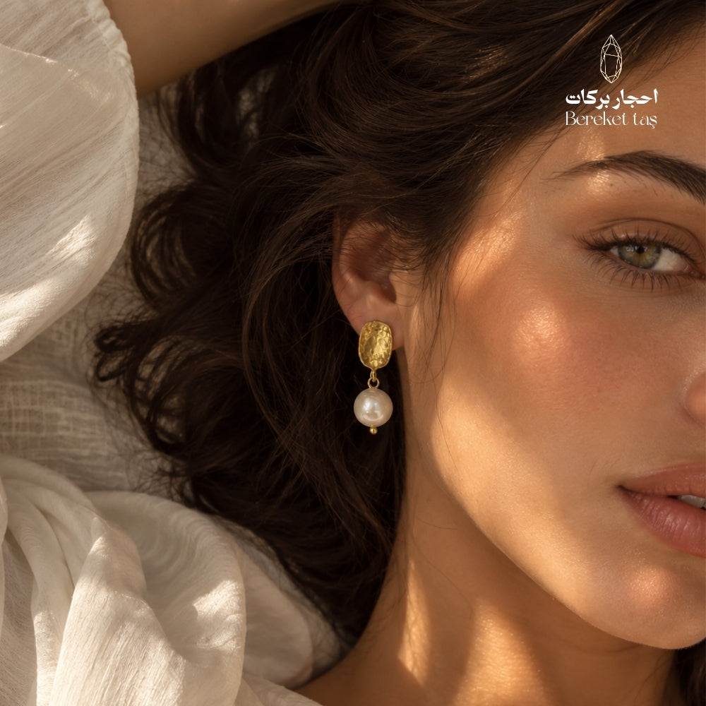 Natural Pearl drop earring with a gold-plated handcrafted metal piece