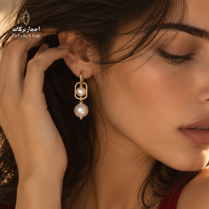 Close-up of a natural Pearl earring with gold-plated copper, showcasing its elegant handcrafted details