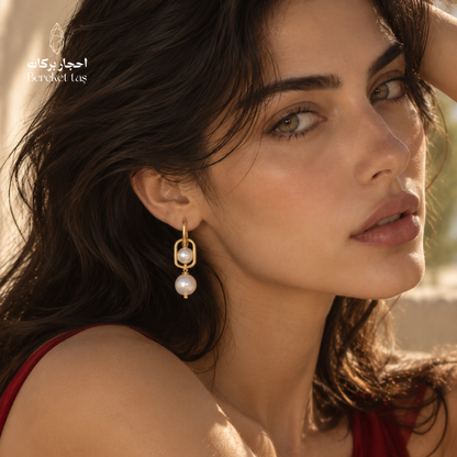 Elegant model wearing natural Pearl drop earrings with gold-plated copper, highlighting the refined handcrafted jewelry design