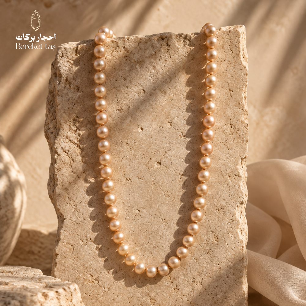 Natural Pearl handmade necklace with luminous pearl beads displayed on a warm stone surface