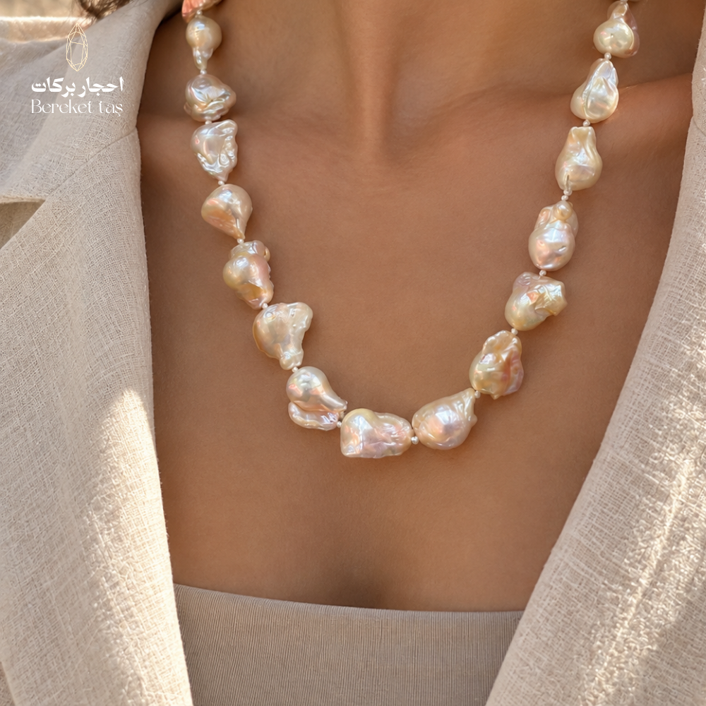 Close-up of a handmade natural Pearl necklace highlighting the varied bead shapes and luminous details
