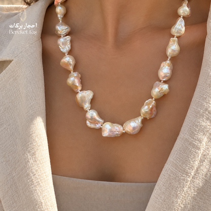 Close-up of a handmade natural Pearl necklace highlighting the varied bead shapes and luminous details