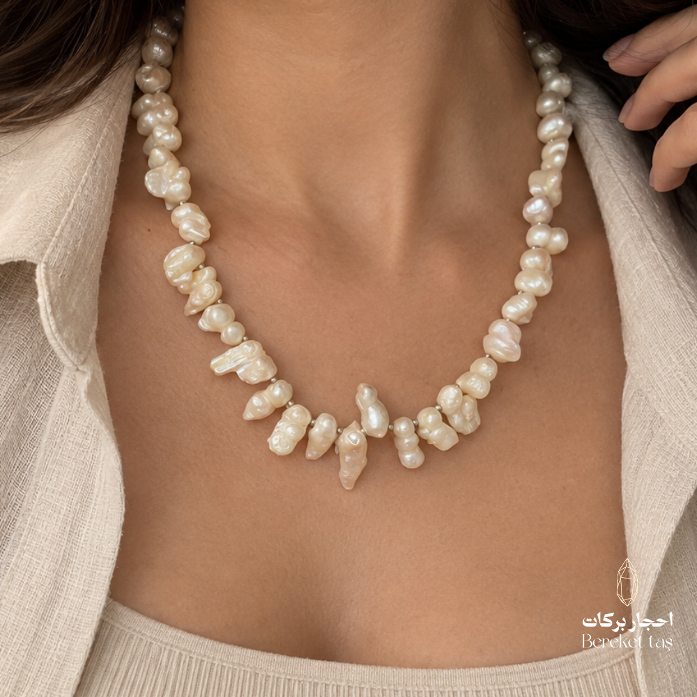 Close-up of a natural white Pearl necklace highlighting the distinctive center arrangement